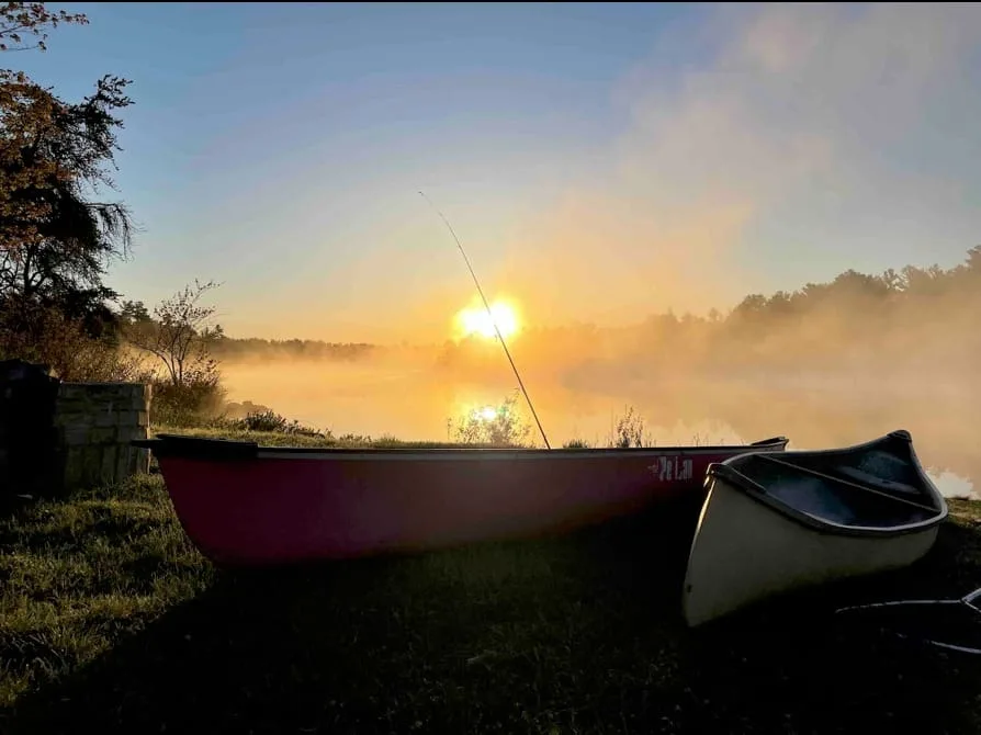 Soft morning mist rising over the water at Hartley Bay Cottages