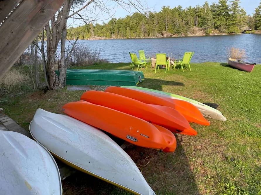 Canoes and kayaks ready for guests at Hartley Bay Cottages