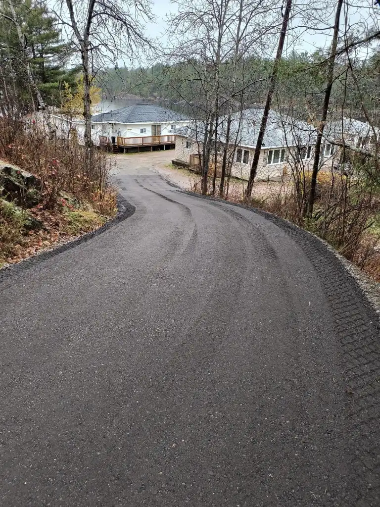 Tree-lined driveway leading to Hartley Bay Cottages